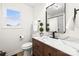 Bathroom featuring new vanity with marble countertop, decorative greenery and new fixtures at 10211 Ridgewell Ct, Charlotte, NC 28215