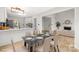 Open-concept dining area adjacent to the modern kitchen, perfect for entertaining and Gathering meals at 10211 Ridgewell Ct, Charlotte, NC 28215