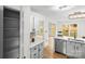 Bright kitchen featuring stainless steel appliances, white cabinets, quartz countertops, and a stylish tile backsplash at 10211 Ridgewell Ct, Charlotte, NC 28215