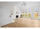 Inviting living room with vaulted ceilings, fireplace, and views of the backyard at 10211 Ridgewell Ct, Charlotte, NC 28215