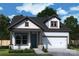 Charming new construction home featuring a gray roof, siding, and a two-car garage at 1035 Bourn Ln, Waxhaw, NC 28173