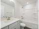Clean, white bathroom featuring a shower-tub combo, white vanity, and modern fixtures at 113 Alluvium Ln, Waxhaw, NC 28173
