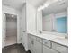 Well-lit bathroom featuring a double sink vanity, tile floors, and bright lights at 113 Alluvium Ln, Waxhaw, NC 28173