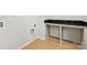 Convenient laundry room featuring a solid surface countertop and wooden floors at 113 Alluvium Ln, Waxhaw, NC 28173