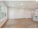 Bright living room featuring recessed lighting, and natural light from large windows at 113 Alluvium Ln, Waxhaw, NC 28173
