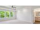Bright main bedroom featuring natural light, neutral paint, and a tray ceiling with fan at 113 Alluvium Ln, Waxhaw, NC 28173