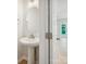 Stylish powder room featuring a pedestal sink, oval mirror, and modern fixtures at 113 Alluvium Ln, Waxhaw, NC 28173