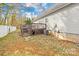 View of the backyard with a deck and patio area, offering potential for outdoor enjoyment and landscaping at 116 Miller Farm Rd, Statesville, NC 28625