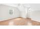 Spacious bedroom featuring wood-look flooring, neutral paint, and natural light at 116 Miller Farm Rd, Statesville, NC 28625
