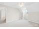Upstairs bedroom features neutral paint, carpet and a ceiling fan at 116 Miller Farm Rd, Statesville, NC 28625