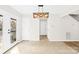 Bright dining area with tile floors, white trim, and access to a deck at 116 Miller Farm Rd, Statesville, NC 28625