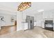 Open kitchen featuring tile flooring, stainless steel refrigerator, and an adjacent seating area at 116 Miller Farm Rd, Statesville, NC 28625