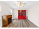 Comfortable living room featuring wood floors, an electric fireplace, and a decorative red cabinet at 116 Miller Farm Rd, Statesville, NC 28625