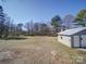 A spacious backyard with a detached garage and ample lawn space at 11611 Old Aquadale Rd, Norwood, NC 28128