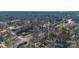 An aerial view of a cozy neighborhood surrounded by lush trees on a sunny day at 1221 20Th Nw Ave, Hickory, NC 28601