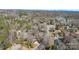 An aerial view showcases a cozy neighborhood by the lake surrounded by lush trees on a sunny day at 1221 20Th Nw Ave, Hickory, NC 28601