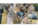 Birds eye view of a home with a dark roof, surrounded by a green lawn and tall trees at 1221 20Th Nw Ave, Hickory, NC 28601