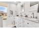 Bright bathroom featuring double vanity with granite countertop and ample natural light from a window at 1221 20Th Nw Ave, Hickory, NC 28601