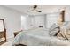 Bright bedroom featuring a ceiling fan, carpeted floors, closet and wooden bedroom set at 1221 20Th Nw Ave, Hickory, NC 28601