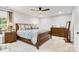 Spacious bedroom featuring a window, ceiling fan, and carpeted floors with wooden bedroom set at 1221 20Th Nw Ave, Hickory, NC 28601
