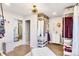 Bright walk in closet featuring wood floors, an ottoman and custom shelving for storage at 1221 20Th Nw Ave, Hickory, NC 28601