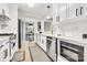 Elegant kitchen with white cabinets, stainless steel appliances, and a view of the breakfast nook at 1221 20Th Nw Ave, Hickory, NC 28601