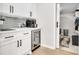 Stylish butler's pantry with white cabinetry, quartz countertops, and beverage cooler at 1221 20Th Nw Ave, Hickory, NC 28601