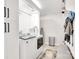 Bright laundry room features modern washer and dryer, ample storage, and stylish tiled flooring at 1221 20Th Nw Ave, Hickory, NC 28601