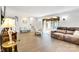 Bright living room boasts hardwood floors and is elegantly furnished with sofa and chairs; stairs visible at 1221 20Th Nw Ave, Hickory, NC 28601