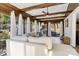Cozy sunroom boasts wood beams, multiple windows and bright light, and a comfortable sectional sofa at 1221 20Th Nw Ave, Hickory, NC 28601