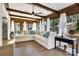 Bright sunroom features exposed wood beams, tons of windows, and a large sectional sofa at 1221 20Th Nw Ave, Hickory, NC 28601