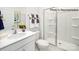 Bathroom featuring a sleek vanity, toilet, and a glass-enclosed shower with neutral tones at 123 Meadowview Dr, Statesville, NC 28677