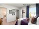Bedroom featuring a comfortable bed, adjacent closet and view to the outdoors at 123 Meadowview Dr, Statesville, NC 28677