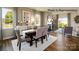 Elegant dining room featuring hardwood floors, a fireplace, and natural light from large windows at 123 Meadowview Dr, Statesville, NC 28677