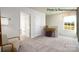 Hallway area featuring neutral walls, carpeted floors, an accent table and a window at 123 Meadowview Dr, Statesville, NC 28677