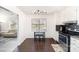 Kitchen breakfast nook with modern lighting, stainless steel appliances, and tile flooring at 12319 Delcorte Ln, Pineville, NC 28134