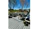 Spacious back deck with chairs and furnishings perfect for entertaining or relaxing at 139 Tenth Green Ct, Statesville, NC 28625