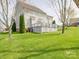 Expansive backyard featuring a well-maintained lawn and spacious deck at 139 Tenth Green Ct, Statesville, NC 28625