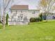 Expansive backyard featuring a well-maintained lawn and spacious deck at 139 Tenth Green Ct, Statesville, NC 28625