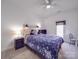 Bedroom with ceiling fan, door to exterior, and carpet at 139 Tenth Green Ct, Statesville, NC 28625