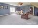Spacious bonus room with carpet flooring, a ceiling fan, and abundant natural light at 139 Tenth Green Ct, Statesville, NC 28625