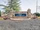 Stone monument sign for 'The 500 Club' community entrance with landscaped flowerbeds and mulch at 139 Tenth Green Ct, Statesville, NC 28625
