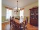Dining room features a wooden table with seating for six and a hutch at 139 Tenth Green Ct, Statesville, NC 28625