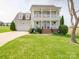 Charming two-story home with a well-manicured front lawn and inviting curb appeal at 139 Tenth Green Ct, Statesville, NC 28625