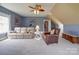 Spacious living room with neutral decor, ceiling fan, and ample seating at 139 Tenth Green Ct, Statesville, NC 28625