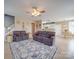 Inviting living room with a cozy fireplace, neutral tones, and ample natural light at 139 Tenth Green Ct, Statesville, NC 28625