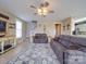 Inviting living room with a cozy fireplace, neutral tones, and ample natural light at 139 Tenth Green Ct, Statesville, NC 28625