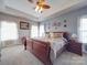 Spacious main bedroom with tray ceiling, fan, and large windows offering ample natural light at 139 Tenth Green Ct, Statesville, NC 28625