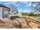 Expansive backyard view featuring a staircase leading up to a covered deck and space for a garden at 141 Ark St, Kings Mountain, NC 28086