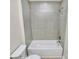 A sleek bathroom features a tiled shower and tub combination, complemented by modern fixtures at 141 Ark St, Kings Mountain, NC 28086
